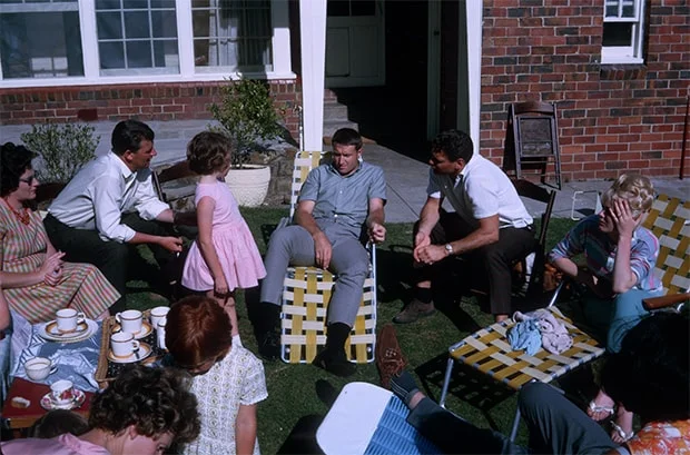 John Nicholls and Chairman of Selectors Gerald Burke at a family barbecue gathering to celebrate Barassi’s much-heralded arrival at the Emanuel family home, Cantala Avenue, Caulfield, around February 1965